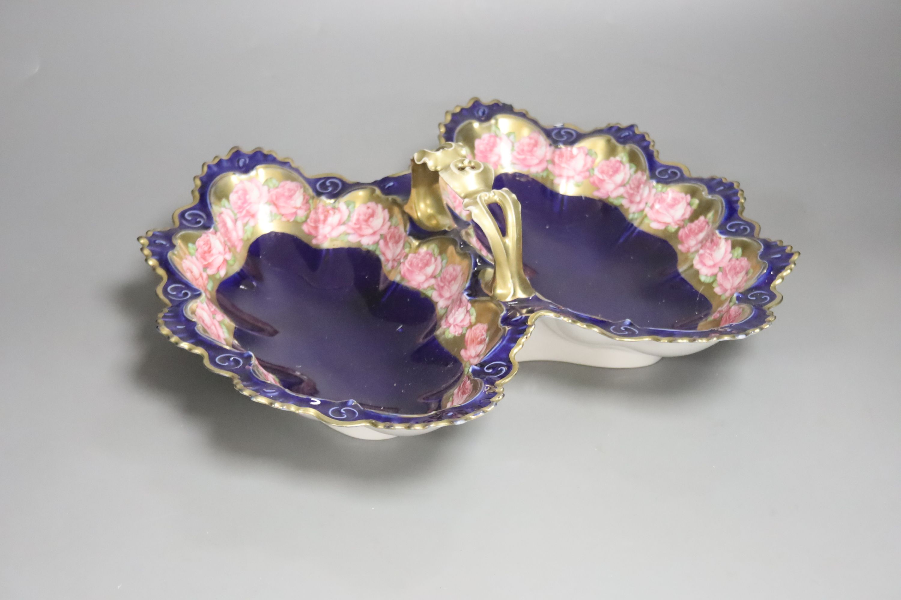 A twin section porcelain basket, two studios vases and a plate